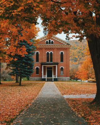 A picture of an orange brick house